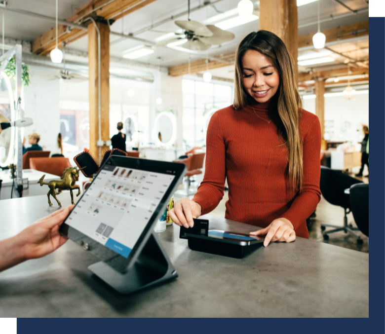 Woman paying in front of POS system